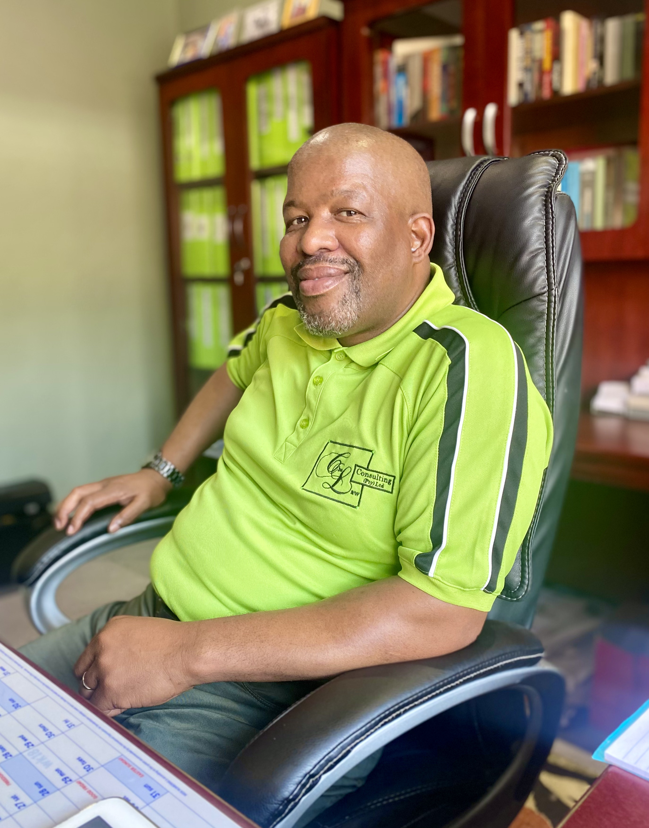 Laws M.K. Mohlomi, Managing Director of Cholaw Consulting, at his desk